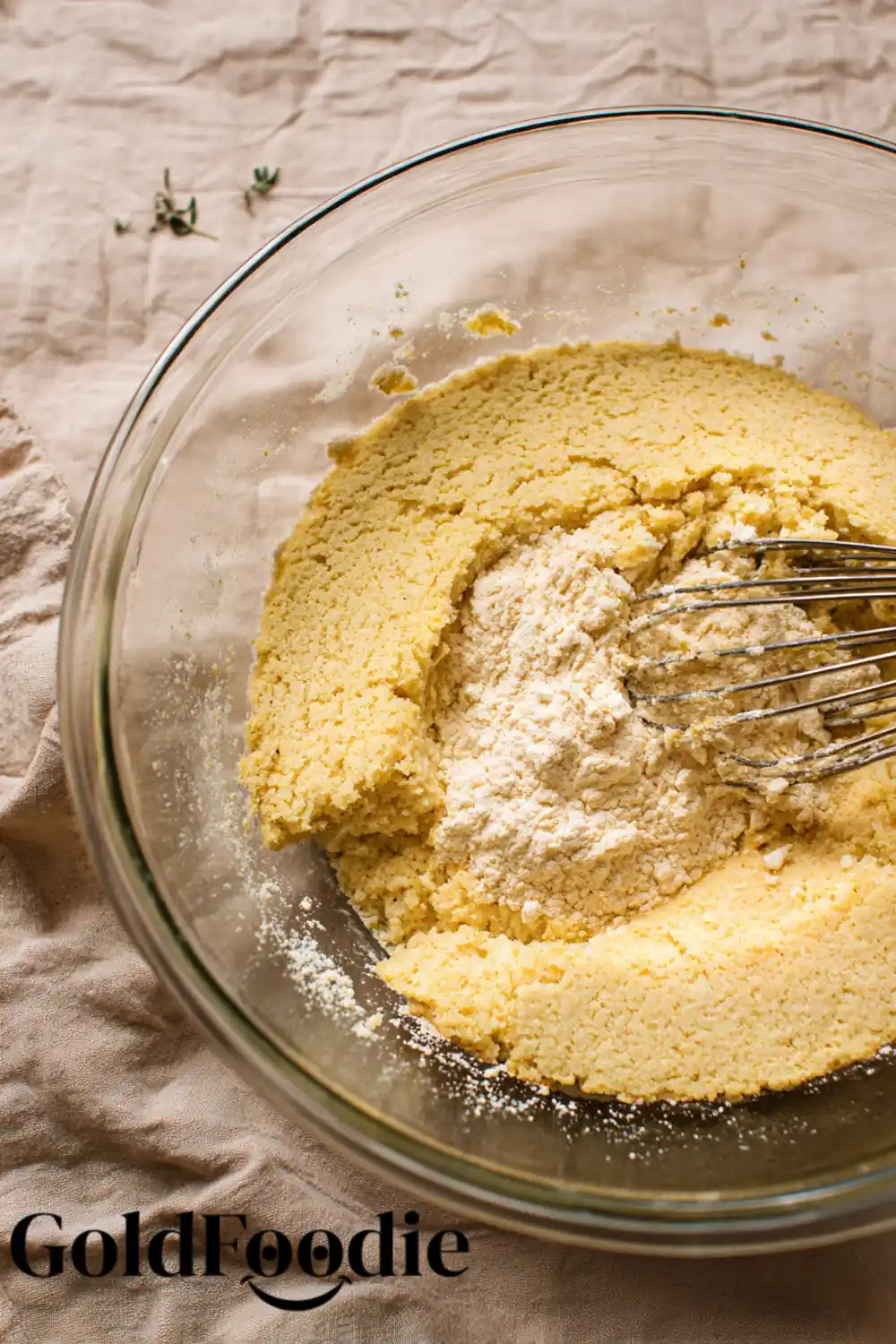 Mixing Gluten Free Cornbread Ingredients Bowl with dry cornbread ingredients and whisk.