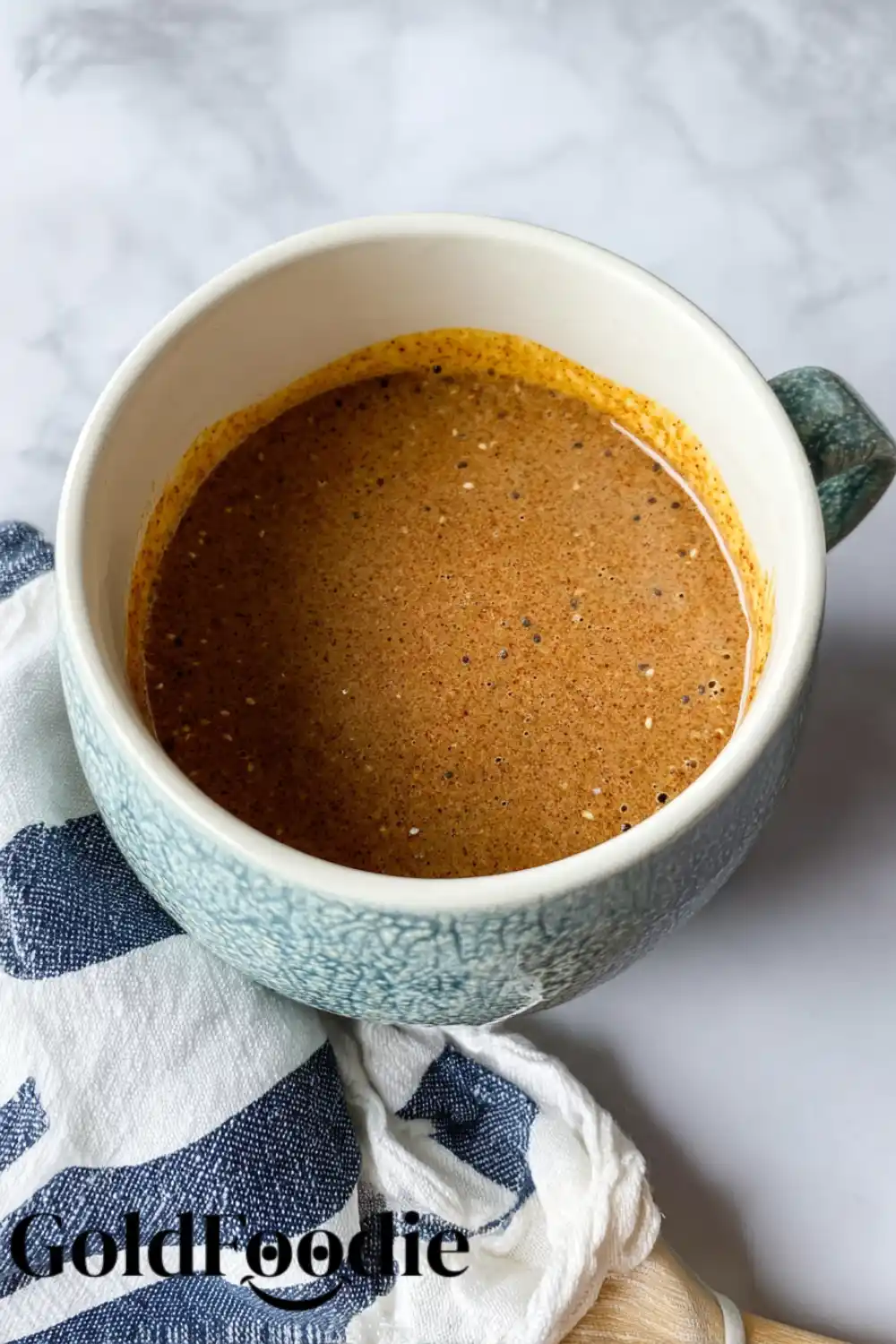 Mug Cake Batter Mug filled with raw chia cake batter before microwaving