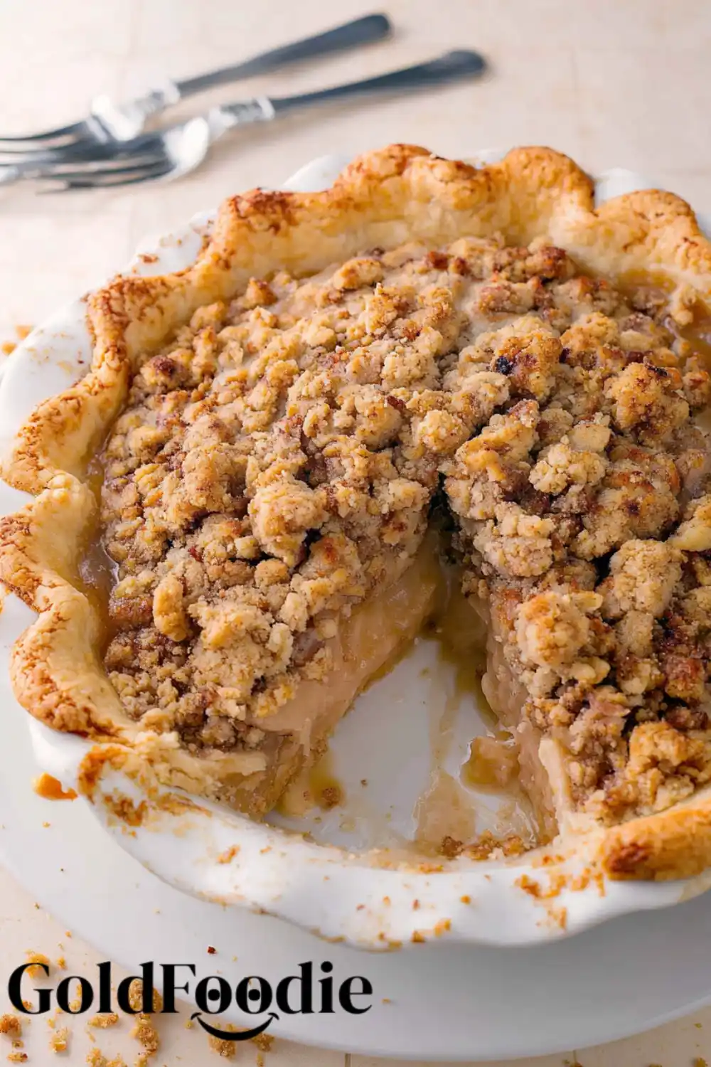 Partially Sliced Crumble Pie Dutch apple pie with scoops of vanilla ice cream