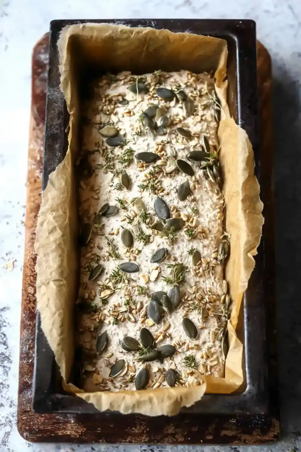 Raw Sunflower Seed Bread Before Baking Unbaked sunflower seed flour batter with herbs and seeds