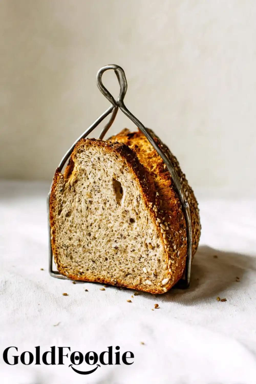 gluten-free vegan seeded buckwheat bread 5 Buckwheat Bread slices with golden crust and seeds.