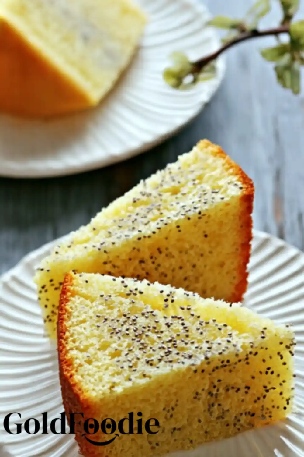 Sliced and Served Two slices of orange chia cake on white plates, ready to enjoy.