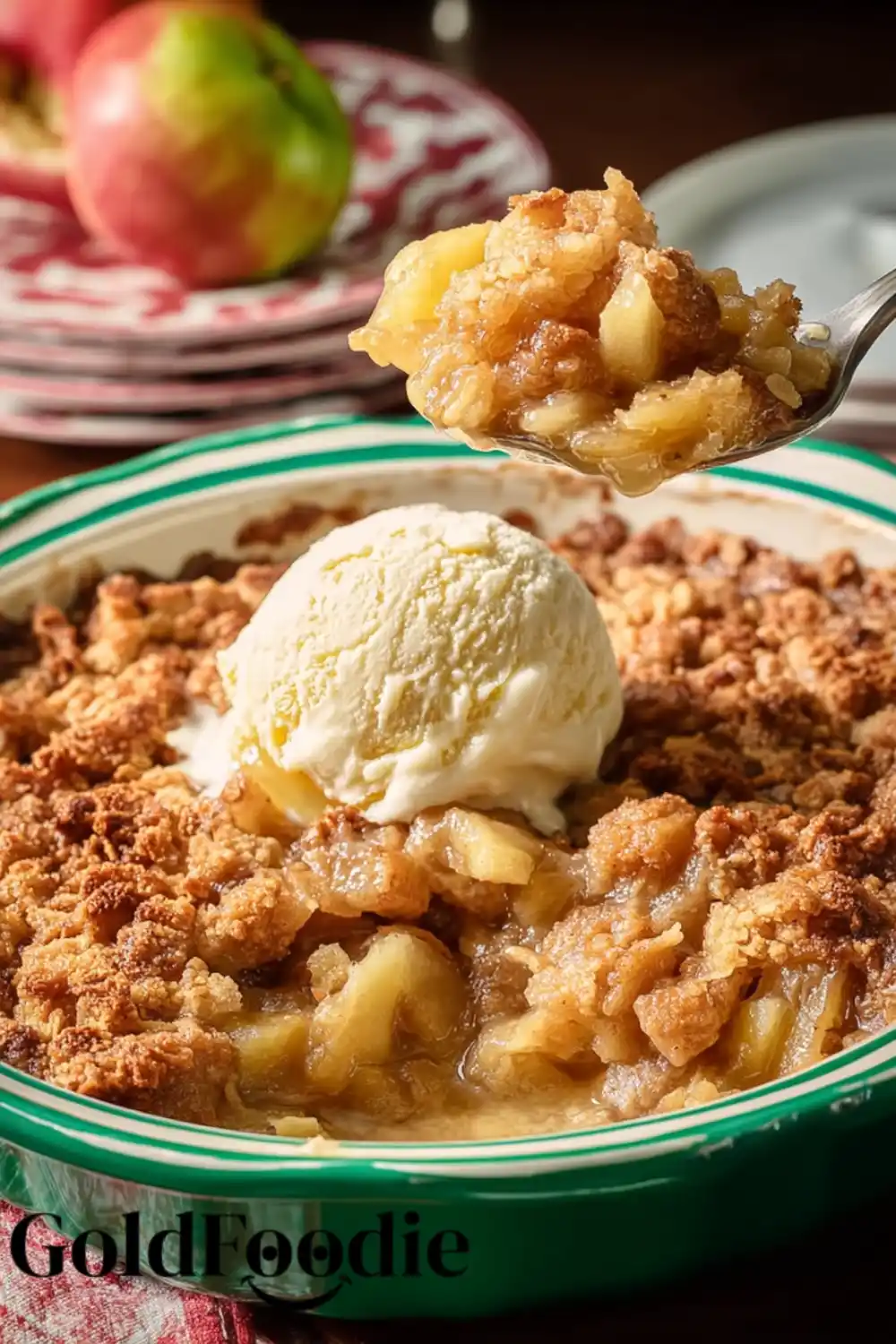 Spoonful of Apple Crisp A spoon lifting warm pionner woman apple crisp from a dish topped with ice cream