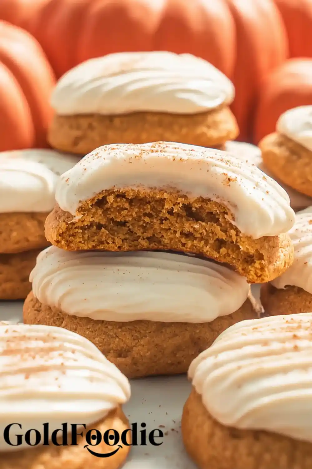 Stacked Pumpkin Cookies Stack of pumpkin cookies with thick cream cheese frosting