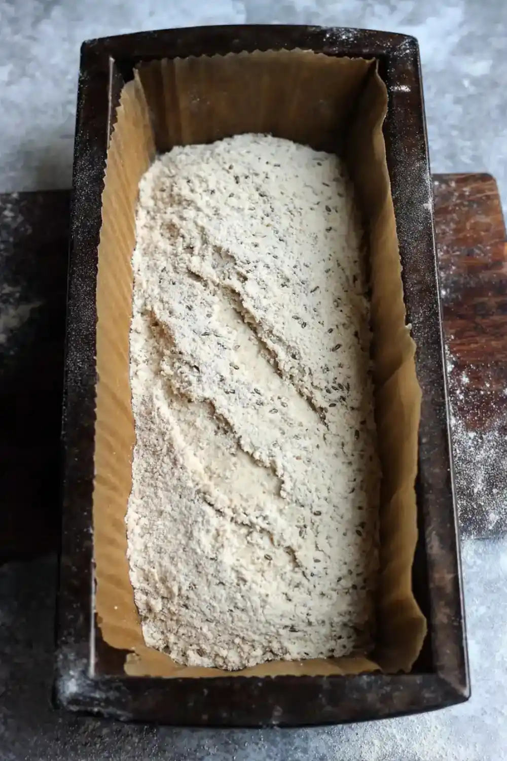 Sunflower Flour Dough in Tin Sunflower seed flour bread batter in loaf pan