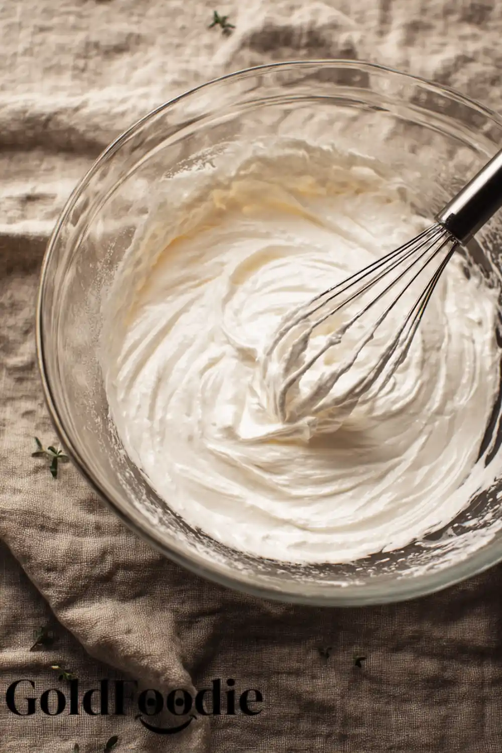 Whipped Aquafaba for Baking Bowl of whipped aquafaba with whisk.