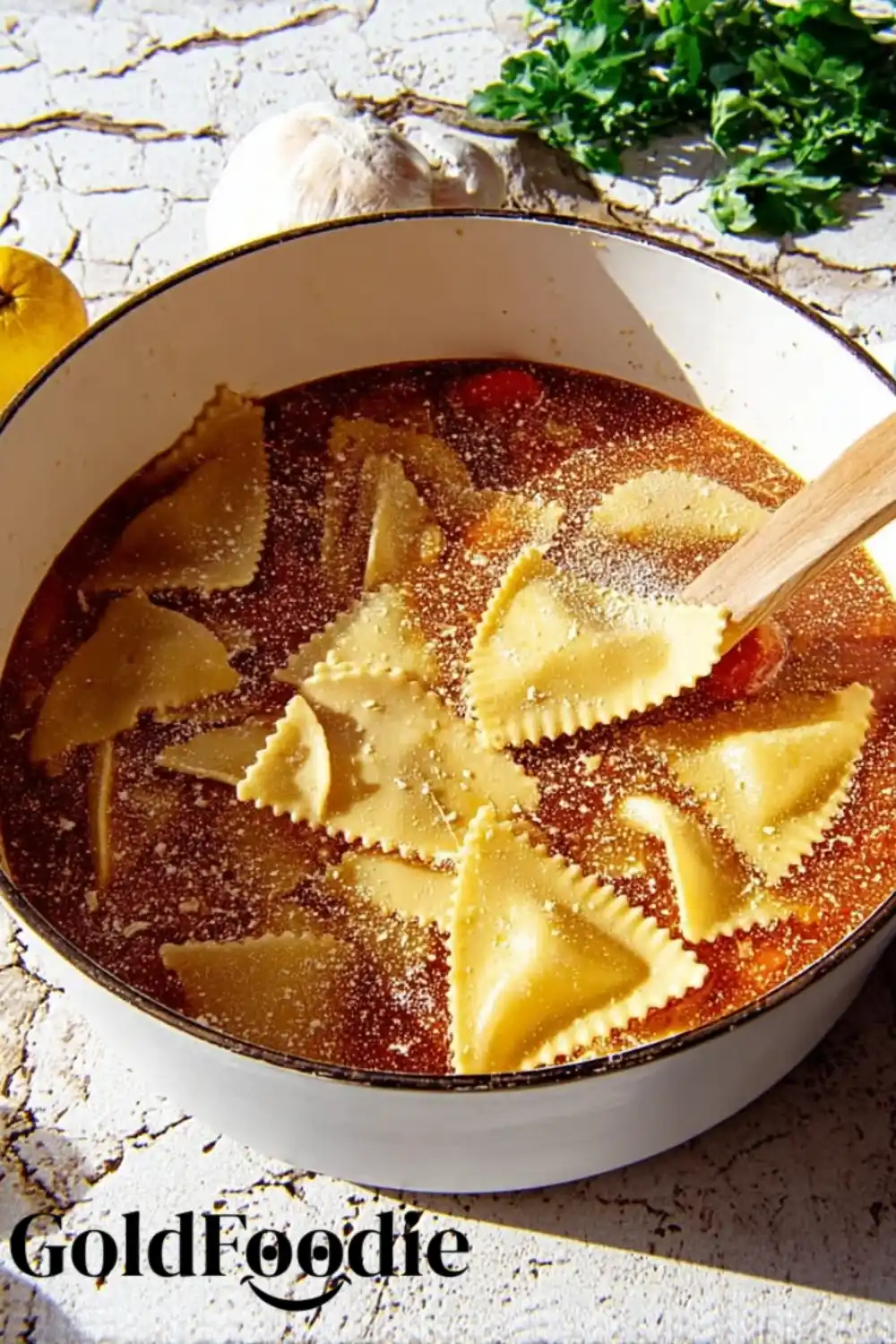 Pasta in Tomato Broth Uncooked ravioli simmering in tomato broth